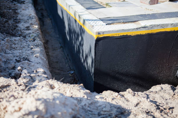 Professional Basement Waterproofing technician working in Morrisville, PA